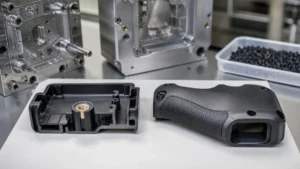 Molded plastic housing with an embedded metal insert beside a housing with a soft overmolded grip.